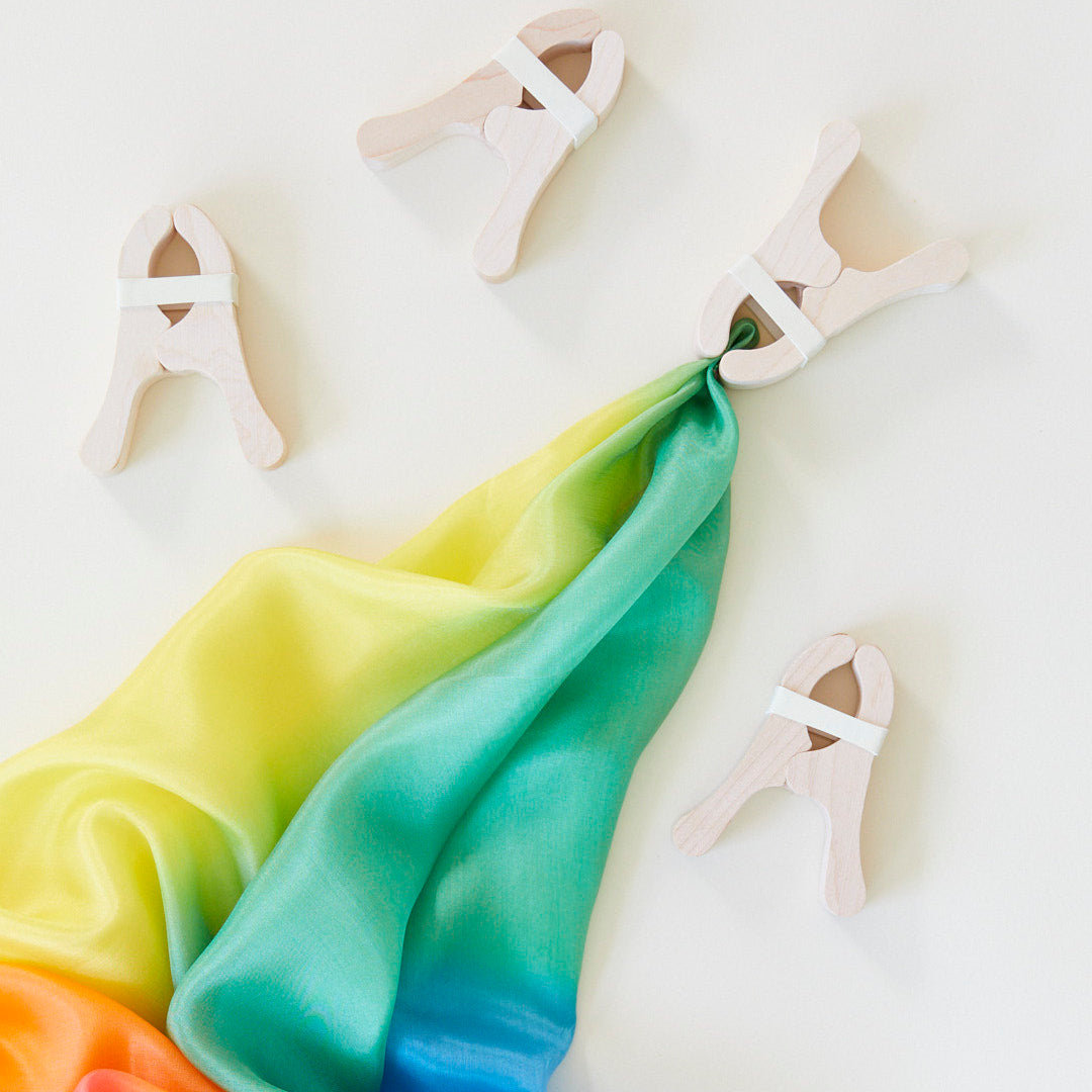 photo of colorful canopy cloth with wooden clips